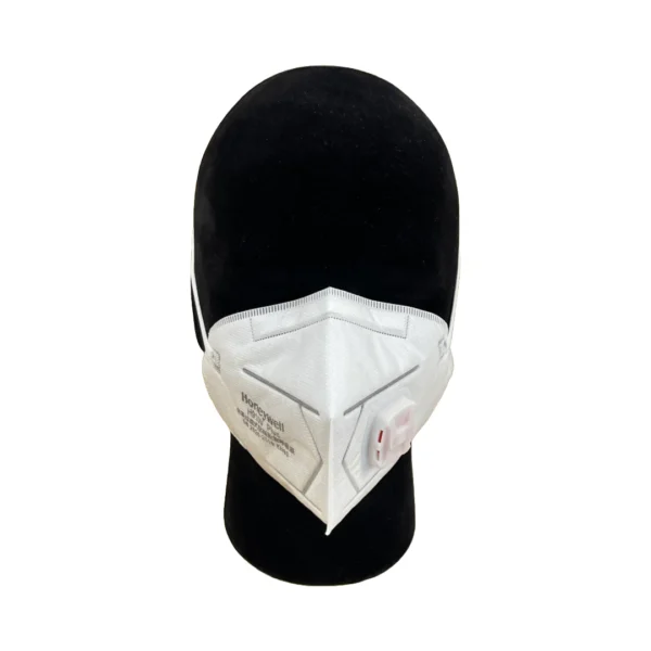 Front-facing view of a Honeywell H910V Plus fold-flat N95 respirator mounted on a black mannequin, showing the white shell, grey trim and exhalation valve.